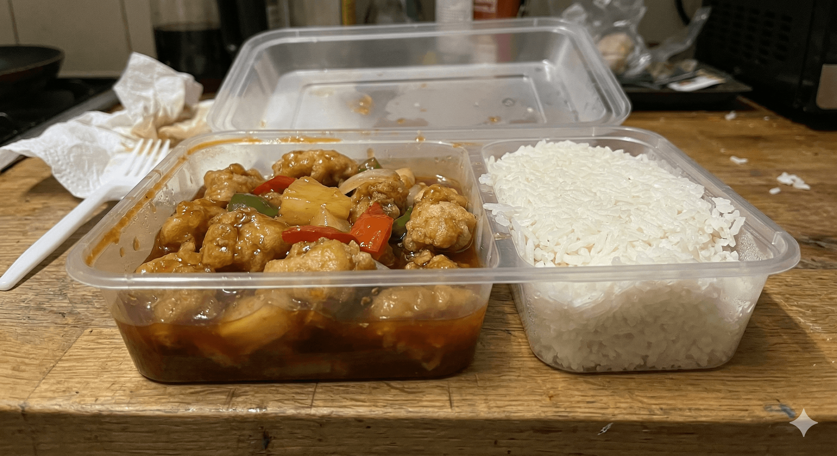 Delivered sweet and sour chicken - takeaway container